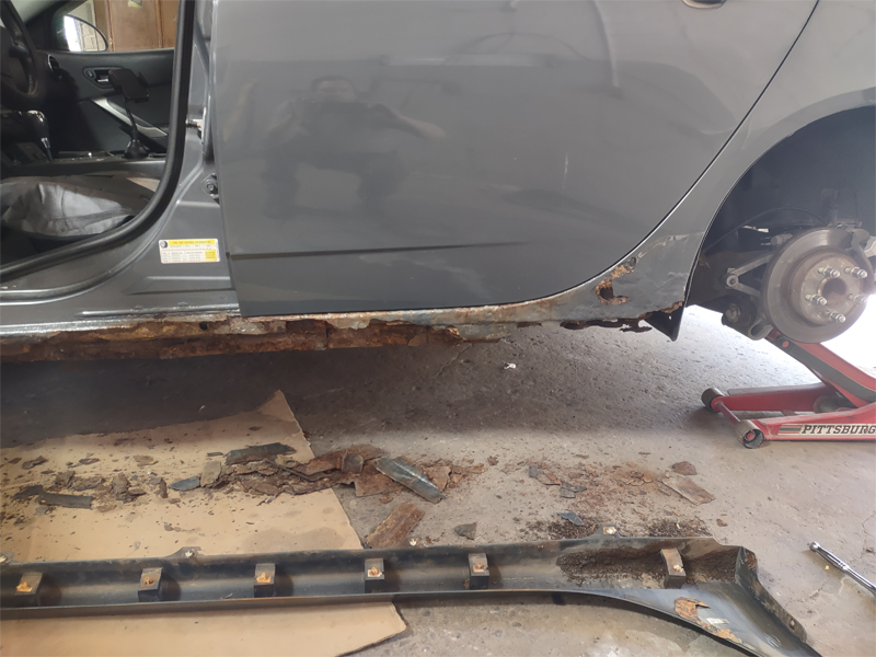 Rocker panel rust repair in progress